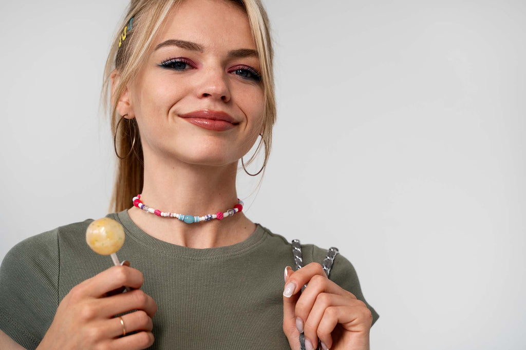 girl with lollipop with necklace