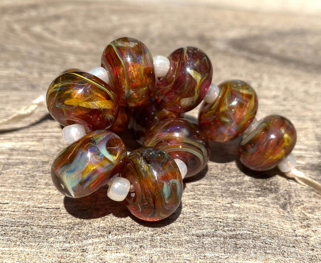 ruby brown swirl lampwork beads